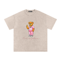 Beige t-shirt with a cartoon bear design and text on a white background